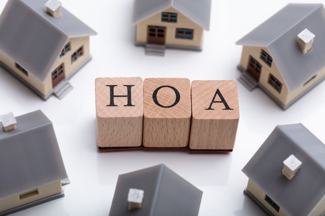 Explore key factors of buying in an HOA community: rules, fees, amenities, financial practices, legalities, insurance, and potential benefits.